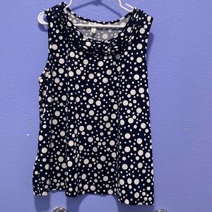 Navy and white polkadotted women’s blouse